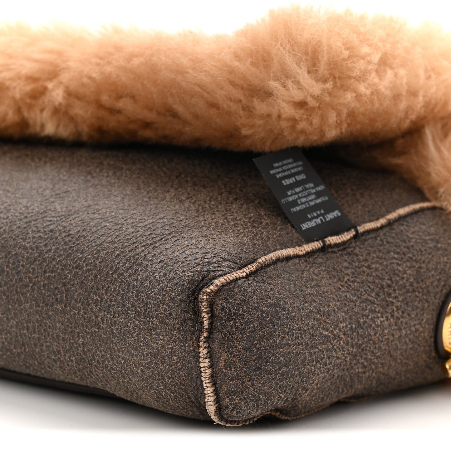 Saint Laurent reversible satchel interior label on dark leather with contrast edge stitching