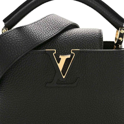 Black pebbled leather mini handbag with top handle and gold V logo centerpiece