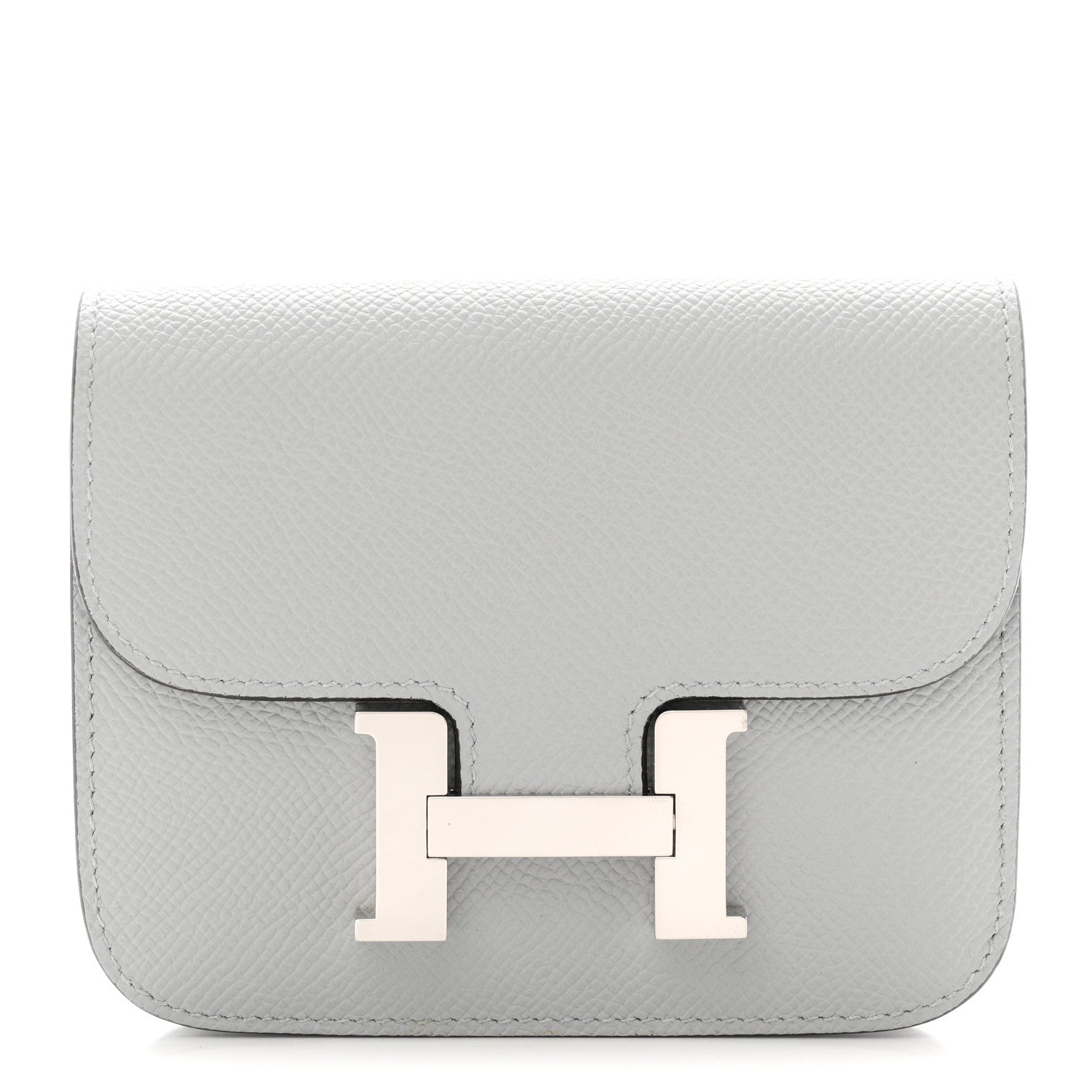 Hermes Constance slim wallet in light blue textured leather with front H clasp.