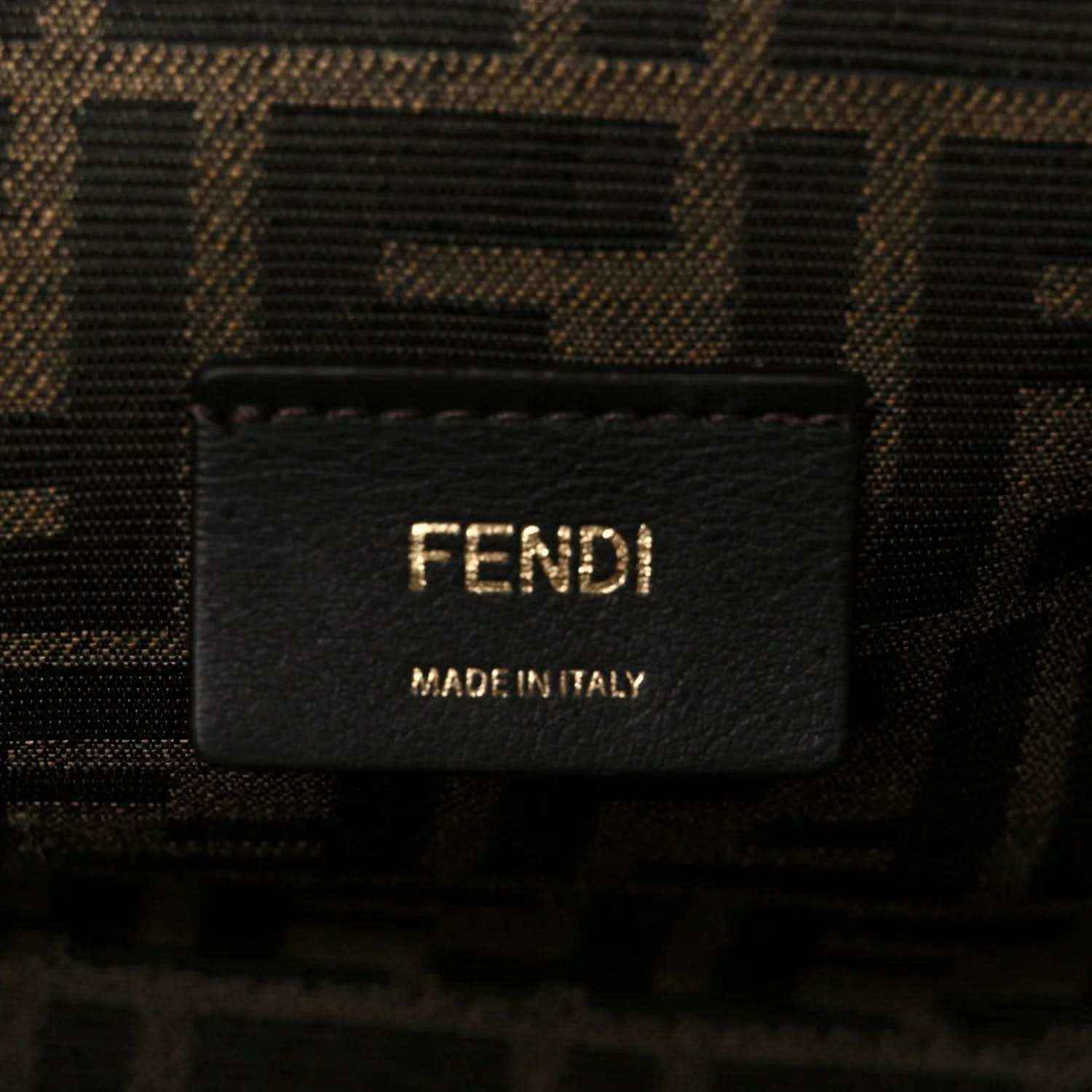 Fendi fabric label on interior of woven leather clutch bag