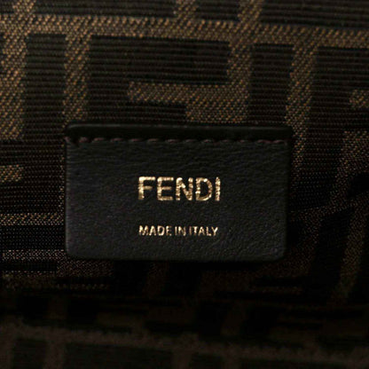 Fendi fabric label on interior of woven leather clutch bag