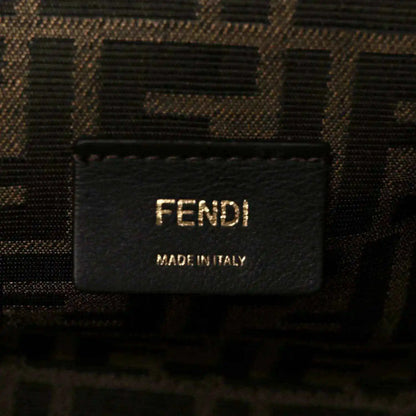 Fendi fabric label on interior of woven leather clutch bag