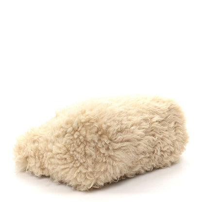 SAINT LAURENT shearling shoulder bag, natural curved profile with plush fur surface