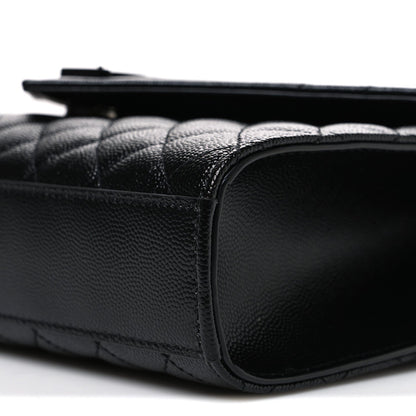 Saint Laurent black satchel side profile with rounded leather corner and trim stitching