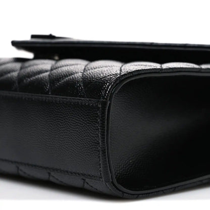 Saint Laurent black satchel side profile with rounded leather corner and trim stitching