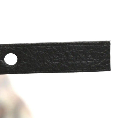 Black leather strap with single round hole detail
