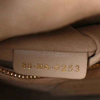 Beige leather size tag with stamped code 8b.MA-0253