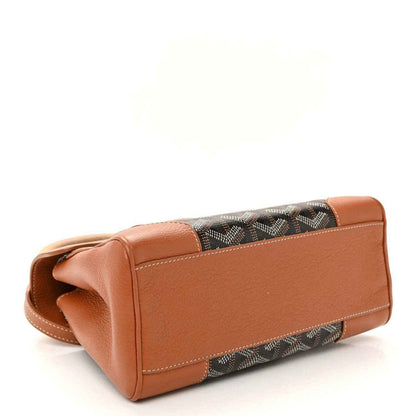 Mini Saigon bag corner view, brown leather sides and trim with patterned canvas base