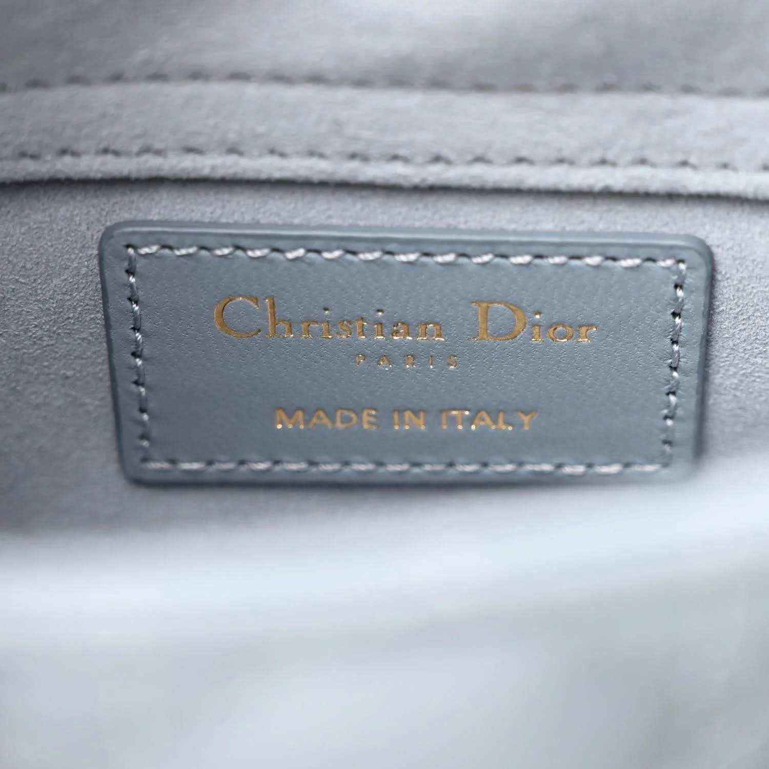Christian Dior leather label on light blue bag, made in Italy text