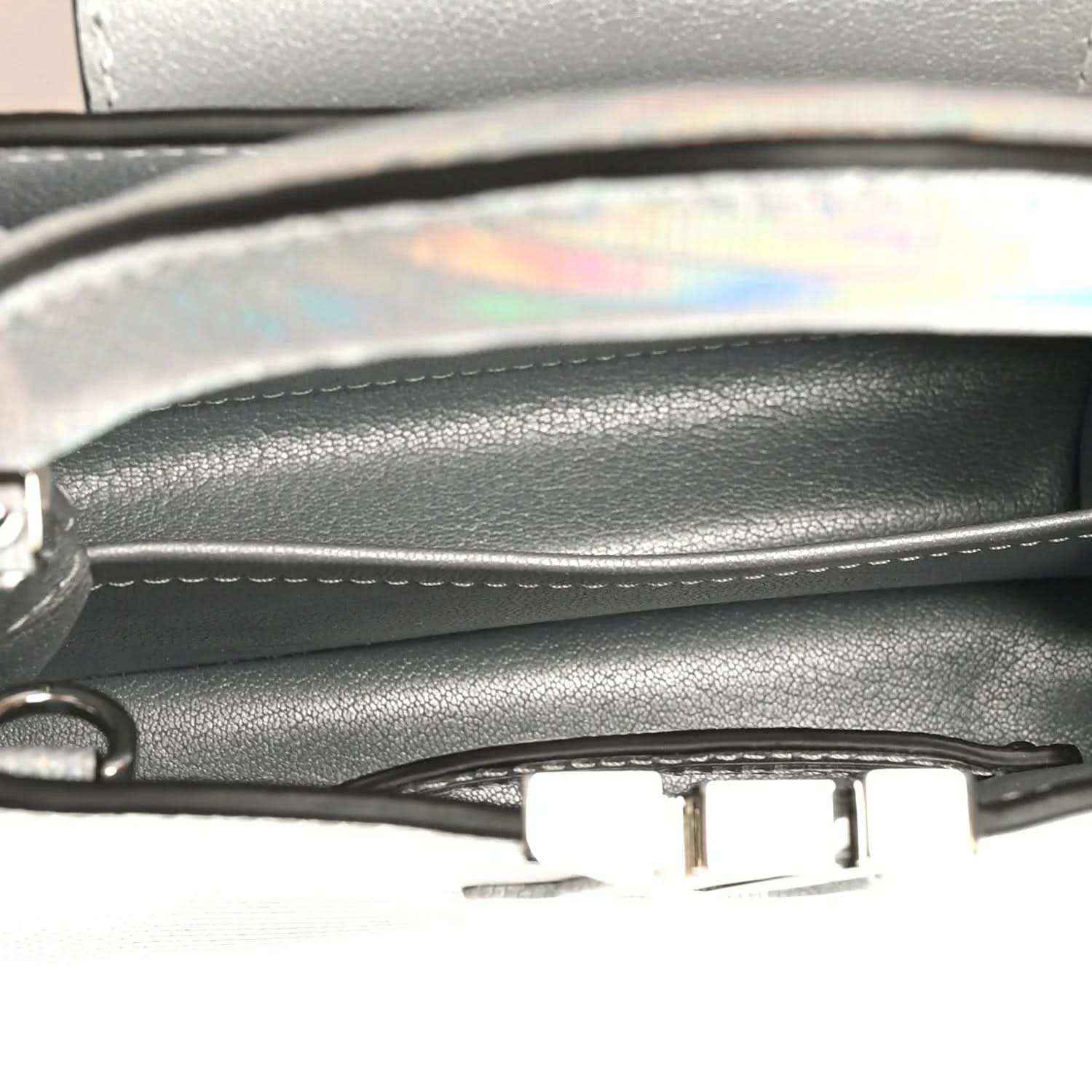 Mini handbag close-up of inner trim and metal clasp near top edge