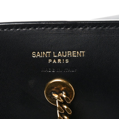 SAINT LAURENT PARIS logo on black leather patch with gold clasp hardware