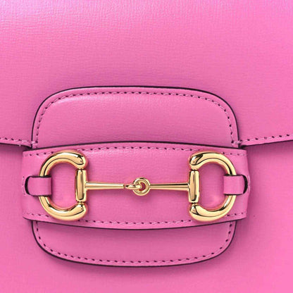Gucci pink flap shoulder bag close-up of gold horsebit clasp and stitching