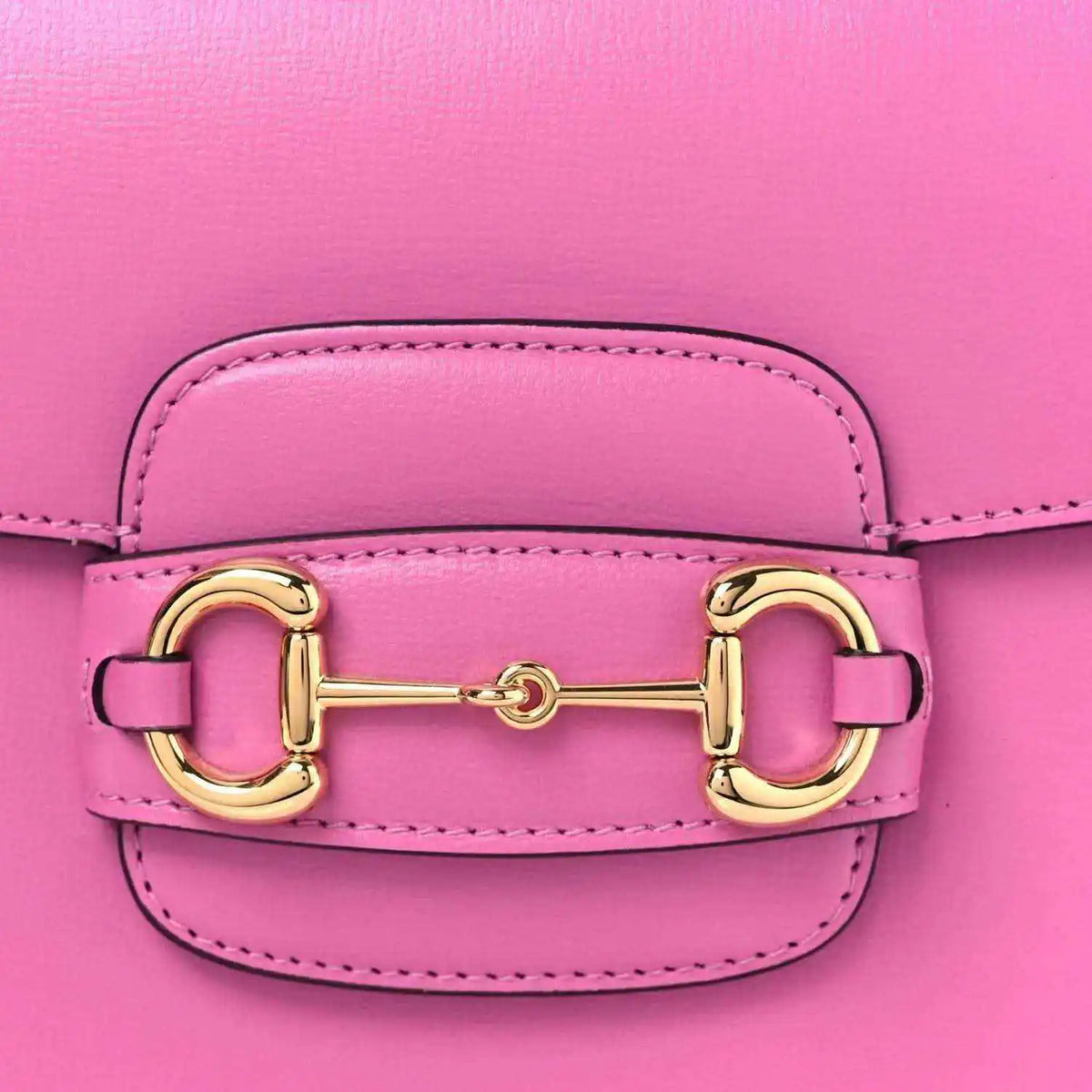 Gucci pink flap shoulder bag close-up of gold horsebit clasp and stitching