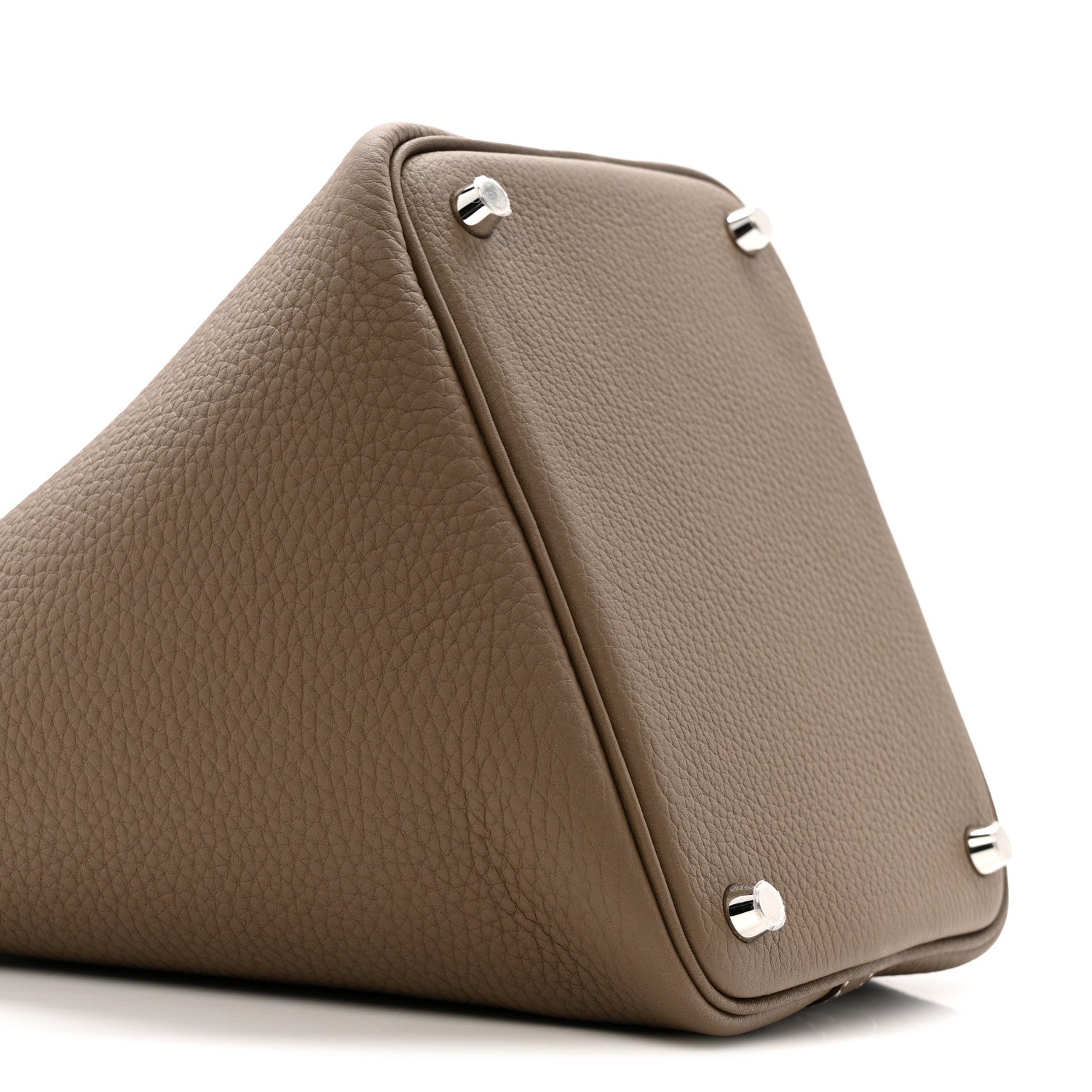 Etoupe leather bag corner with three metal feet and stitched trim