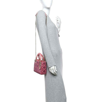 Mini Lady Dior handbag in light pink worn with short top handles and chain strap