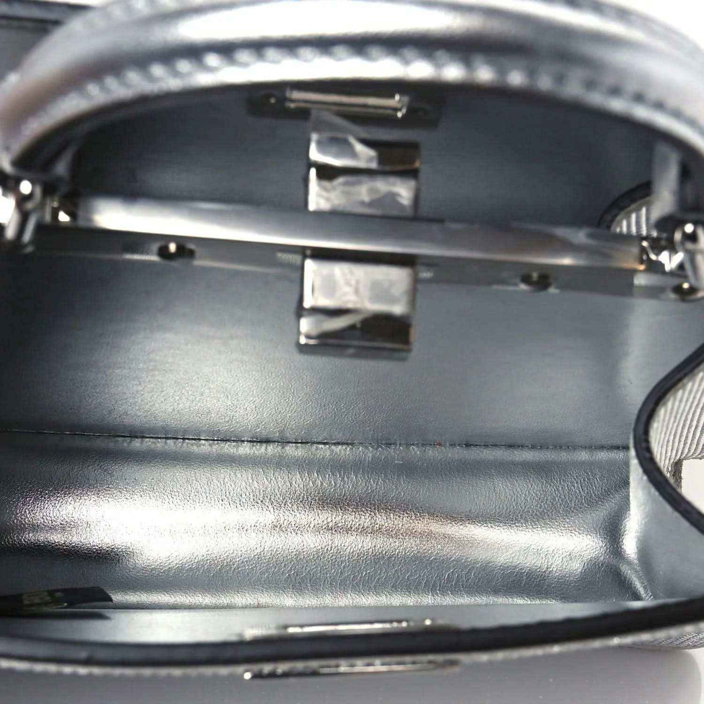 Fendi petite satchel interior: smooth dark lining with leather strap attachments