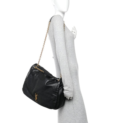 Black quilted lambskin shoulder bag on mannequin with gold chain strap and YSL monogram