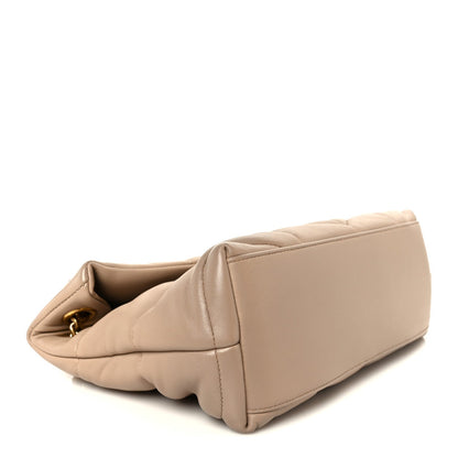 Small puffer chain satchel in dark beige from side and bottom corner