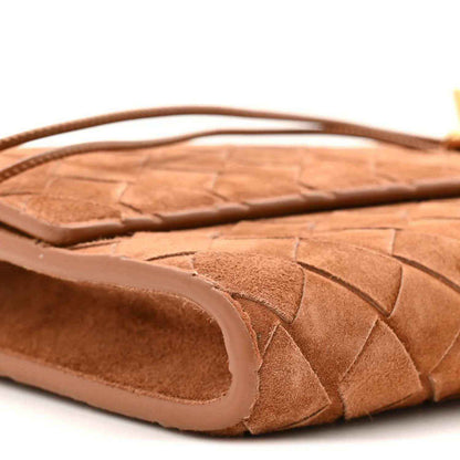 Suede intrecciato clutch top edge with handle strap and amber-brown trim
