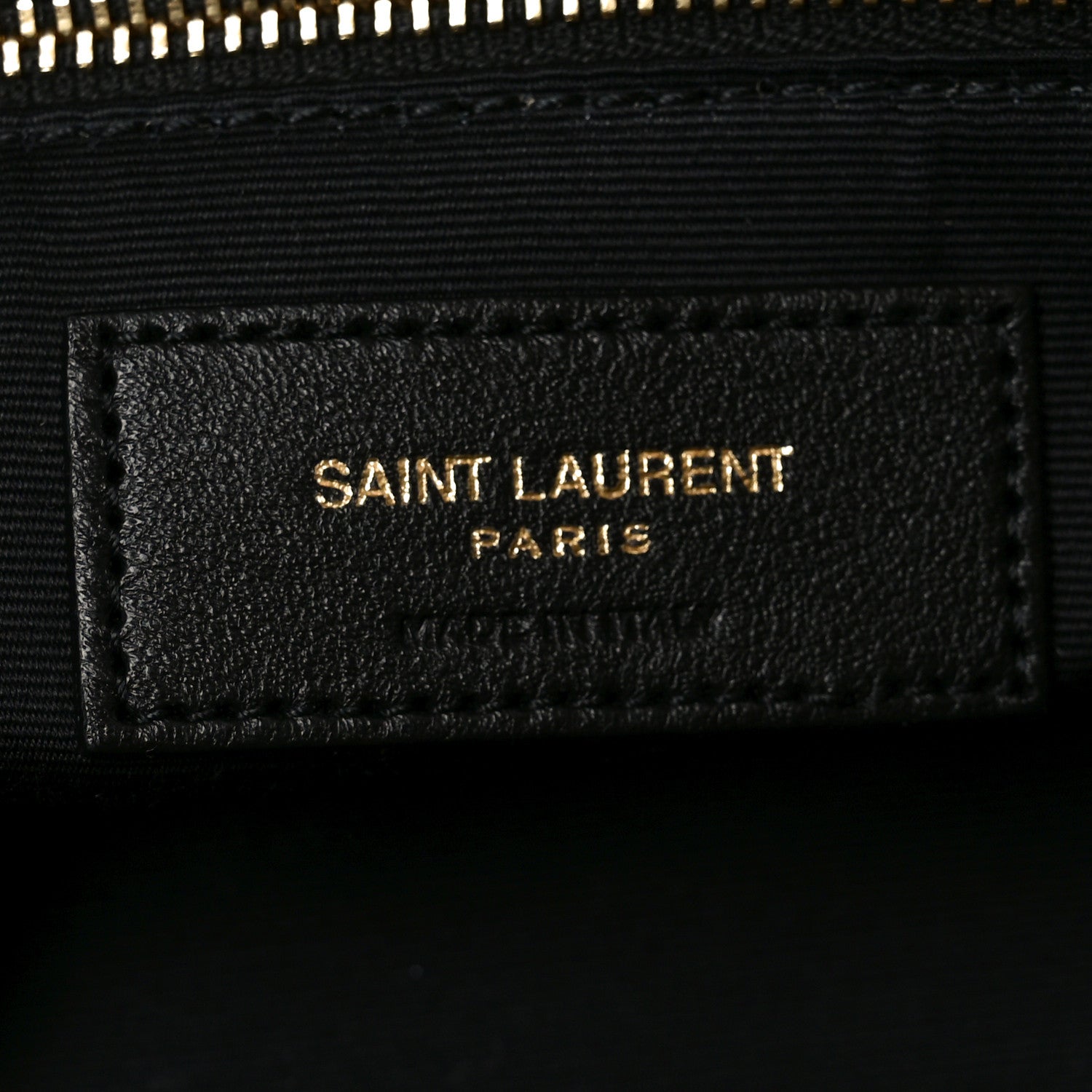 Saint Laurent Calypso bag label, black interior tag with Saint Laurent Paris