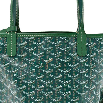 Green reversible tote bag with patterned canvas front and top handles