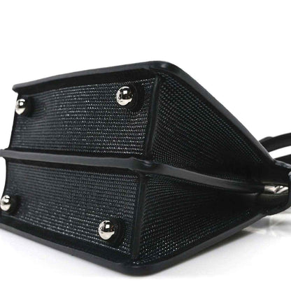 Black crystal satchel with leather base and round hardware feet, angled view