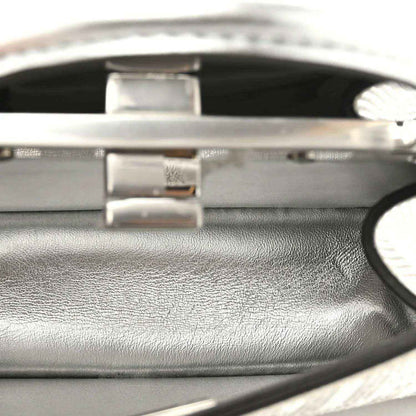 Satchel turn-lock and interior edge trim, silver tone hardware.