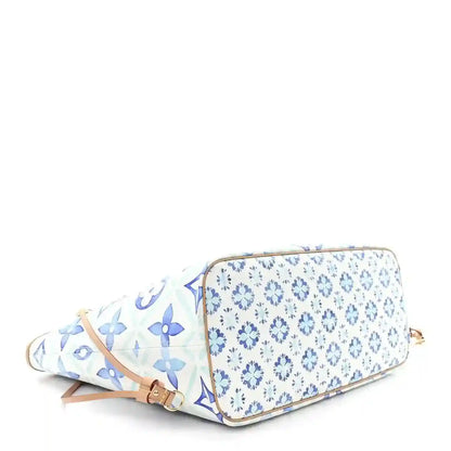 Louis Vuitton zip pouch in blue floral pattern with tan leather zipper trim
