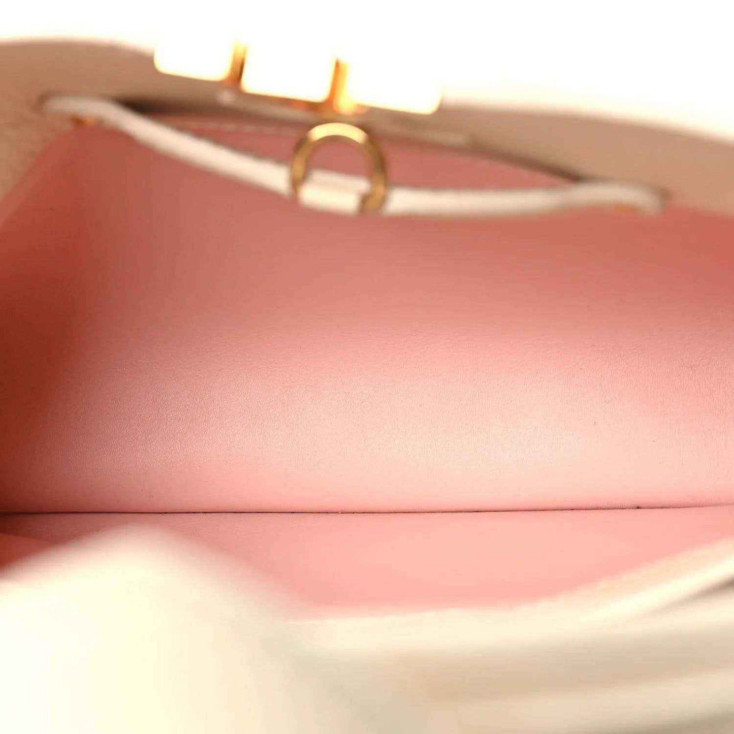 Handbag interior lining in blush pink with textured leather edge