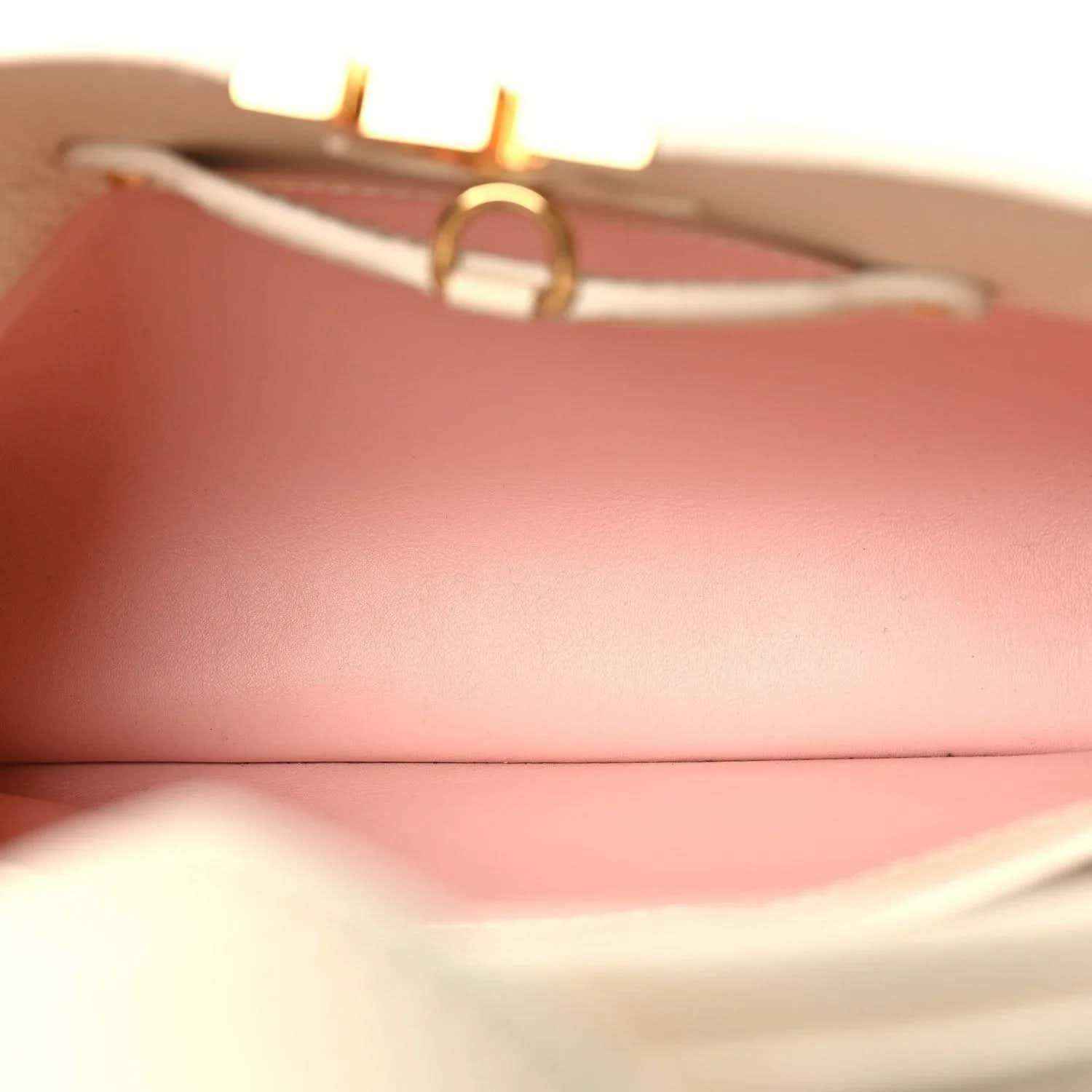 Handbag interior lining in blush pink with textured leather edge