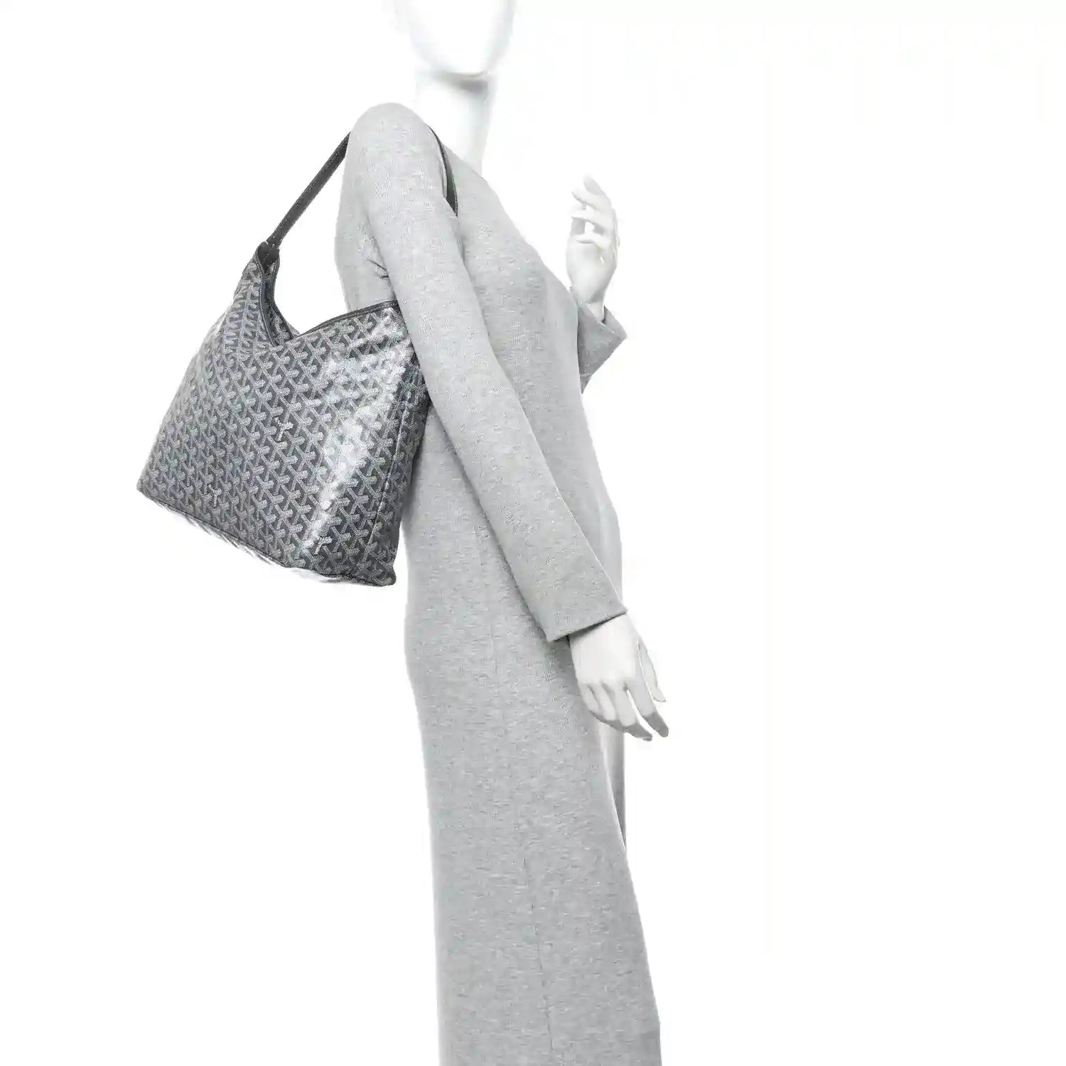 Grey canvas hobo bag with repeating pattern, shown on a model
