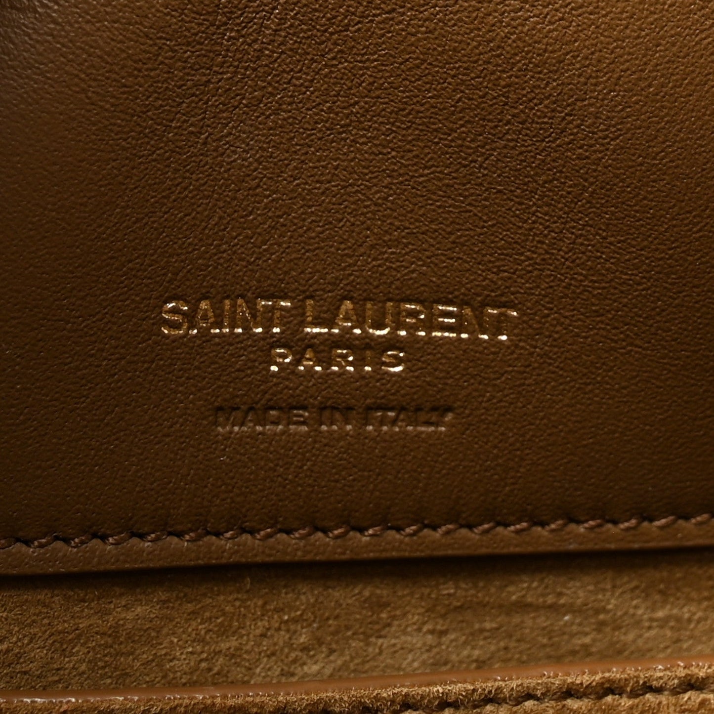 Suede bucket bag leather stamp reading Saint Laurent Paris, golden tan