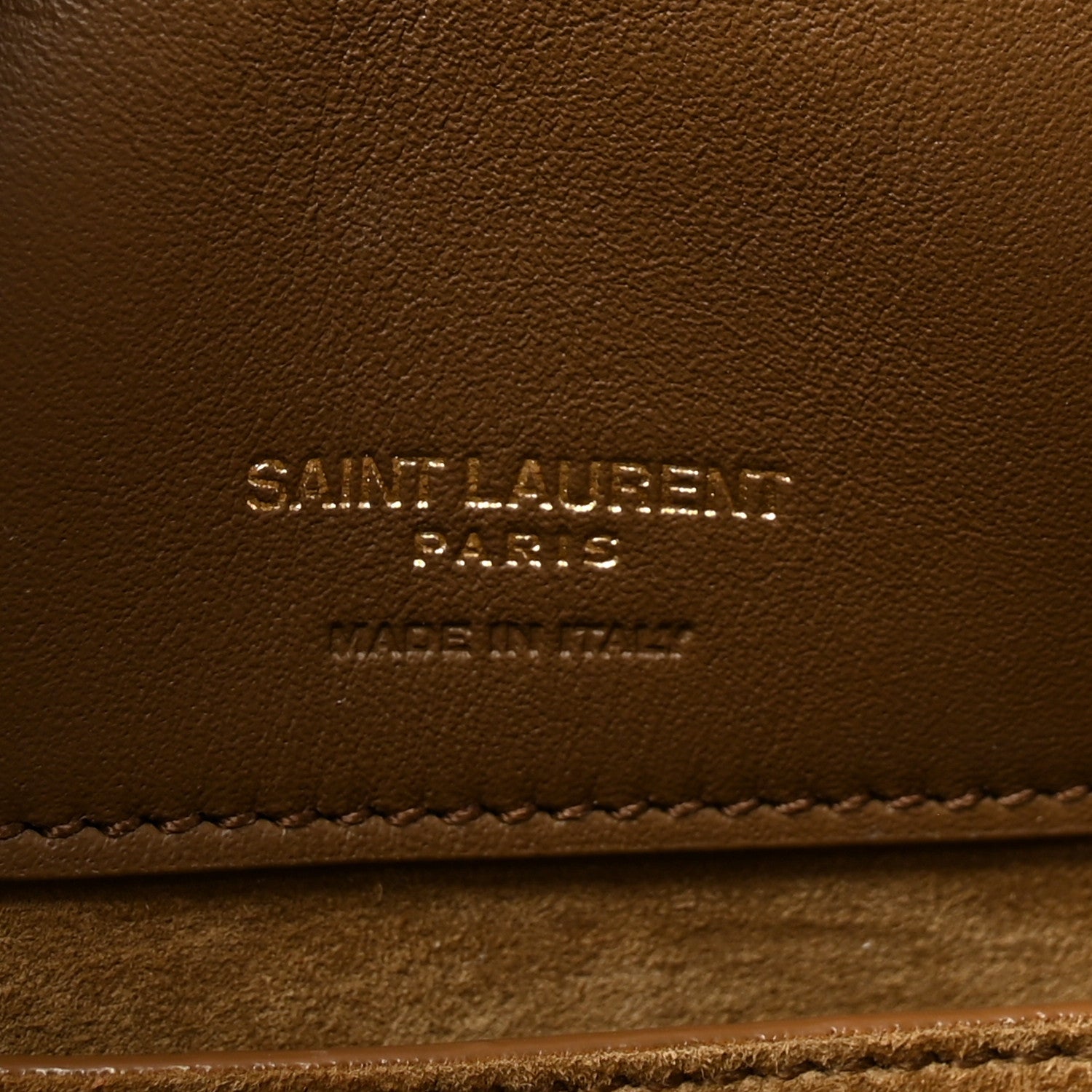 Suede bucket bag leather stamp reading Saint Laurent Paris, golden tan