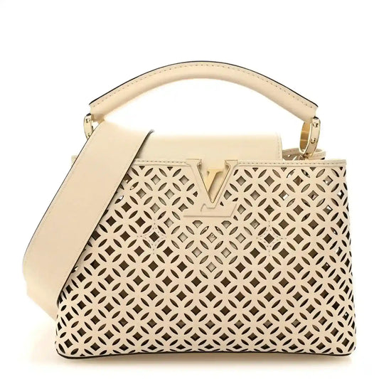Louis Vuitton mini handbag with cut-out lattice pattern and top handle, light base