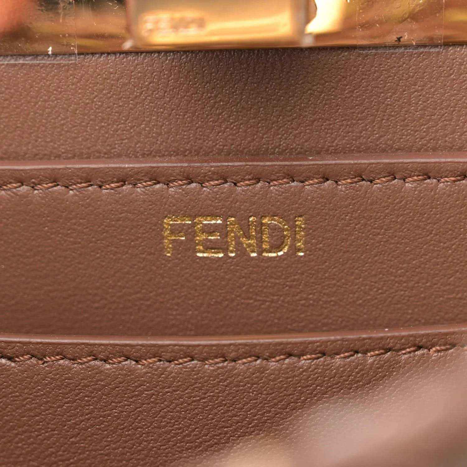 FENDI logo on brown leather satchel front panel with stitched trim