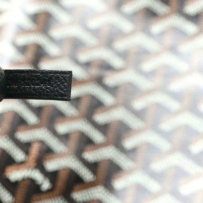 Goyardine monogram canvas close-up in classic black with light geometric pattern
