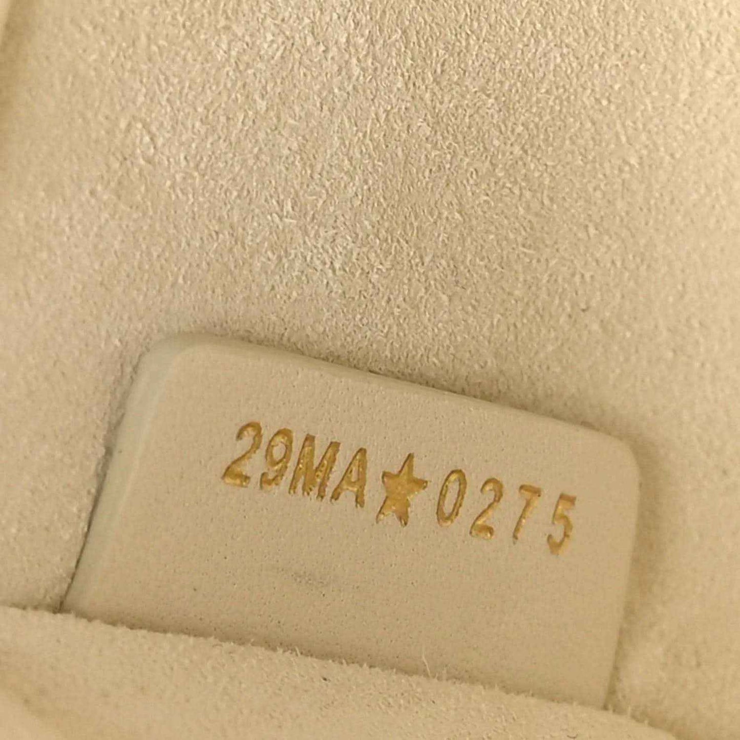 White leather handbag stamp with code 2NMA*0275