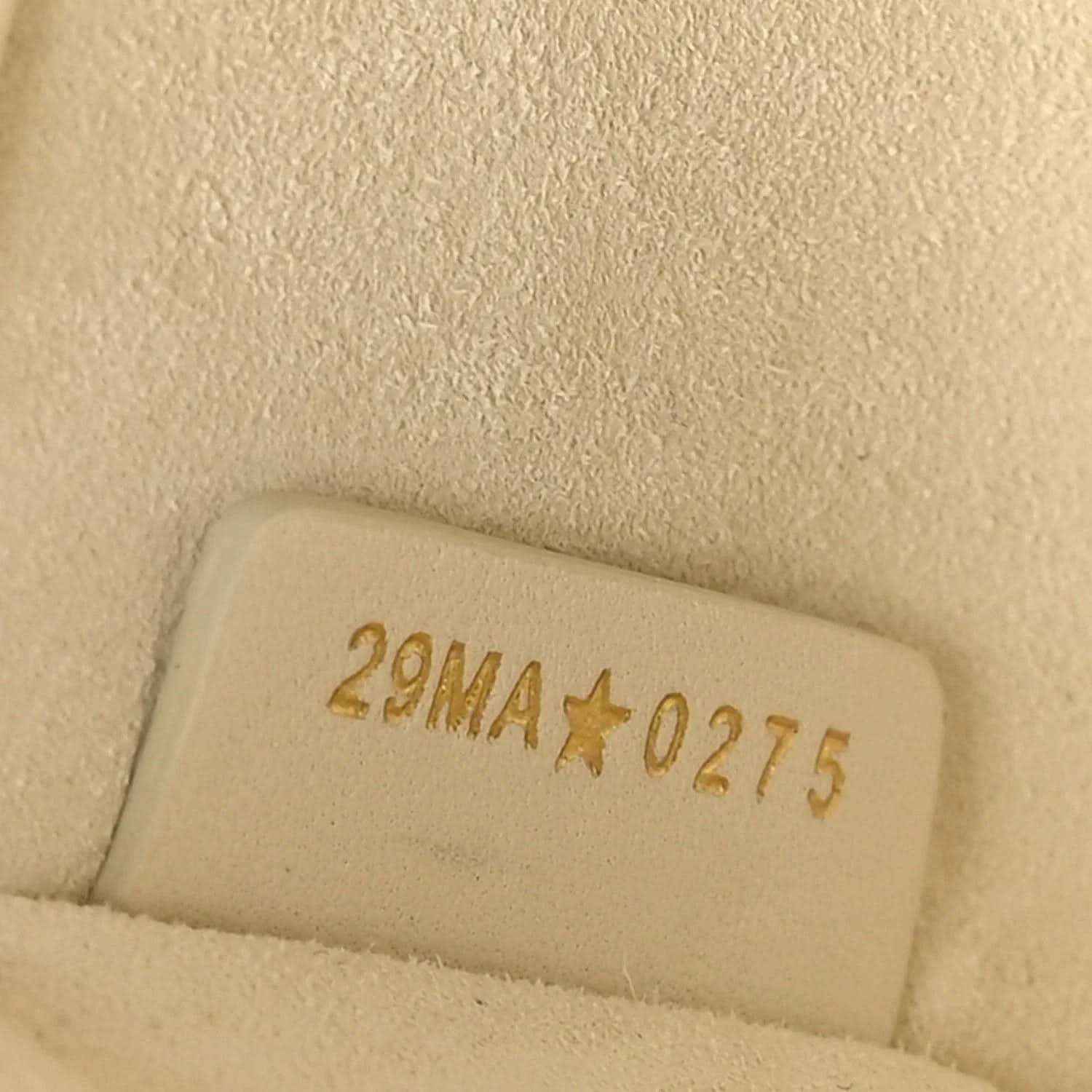 White leather handbag stamp with code 2NMA*0275