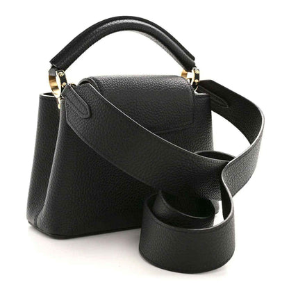 Black pebbled leather mini handbag with top handle and crossbody strap