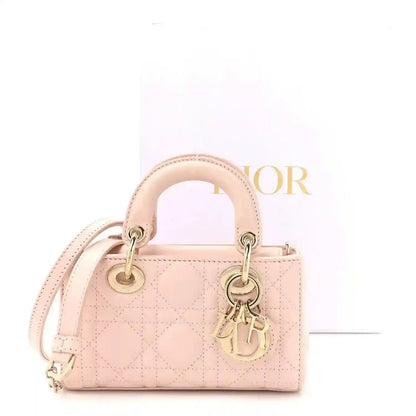 Powder pink lambskin micro bag with double handles, cannage quilting, gold hardware
