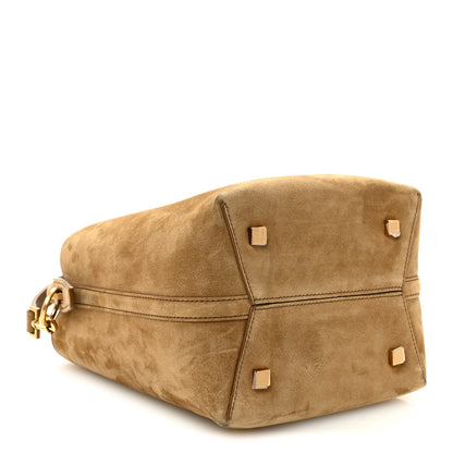 Suede bucket bag top view with square studs on flap, golden tan suede