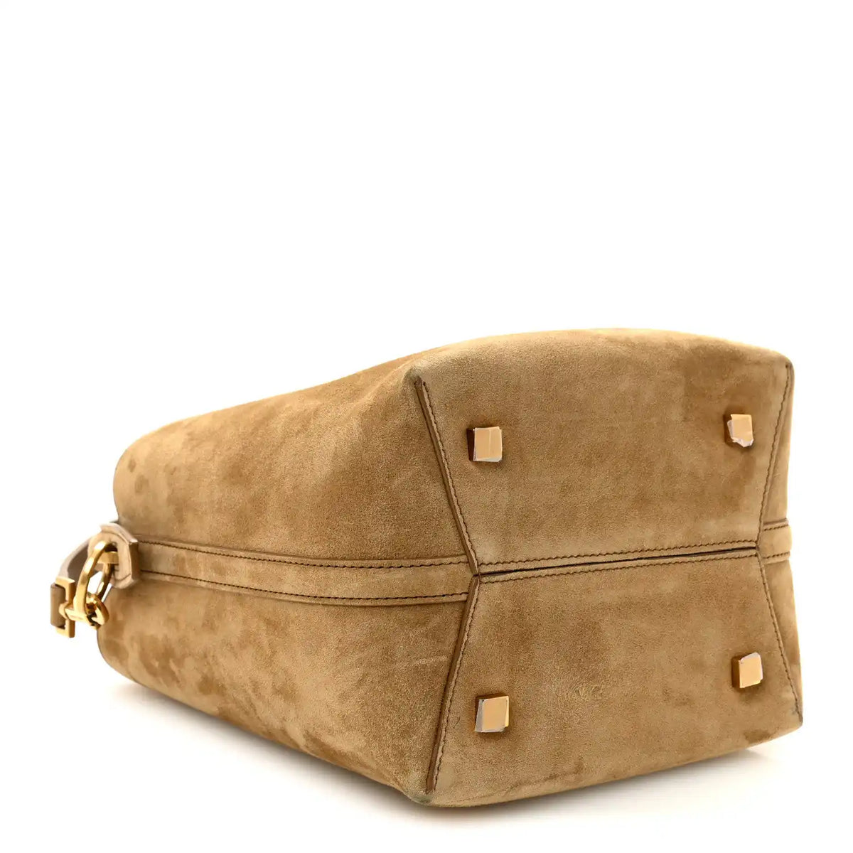 Suede bucket bag top view with square studs on flap, golden tan suede