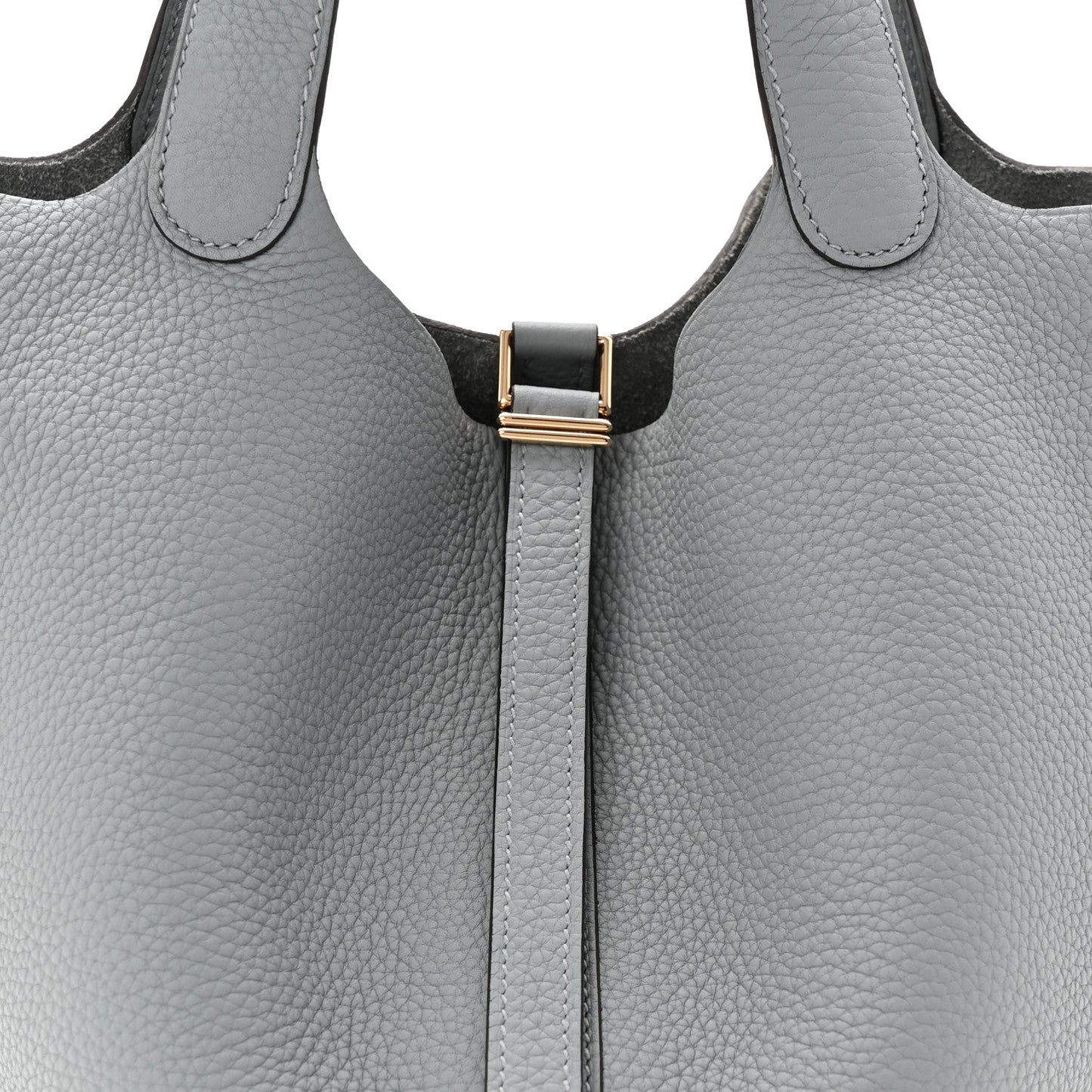 Light gray leather tote bag with top handles and black clasp lock