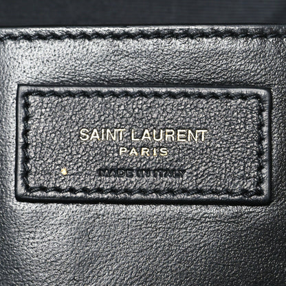 Saint Laurent Paris made in Italy leather label patch on dark-brown bag interior