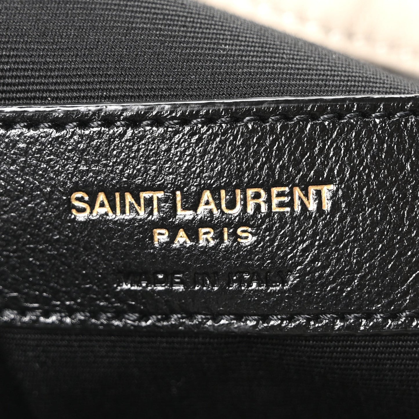 SAINT LAURENT PARIS leather stamp on bag lining with stitched trim