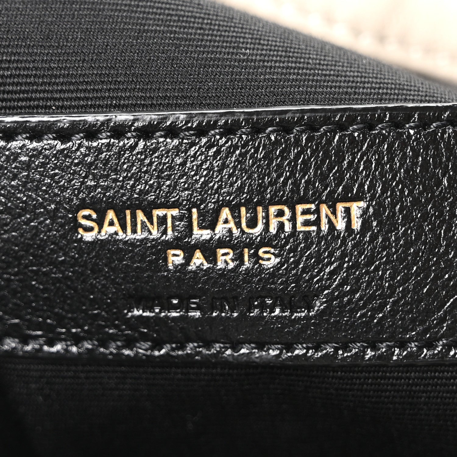 SAINT LAURENT PARIS leather stamp on bag lining with stitched trim