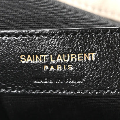 SAINT LAURENT PARIS leather stamp on bag lining with stitched trim