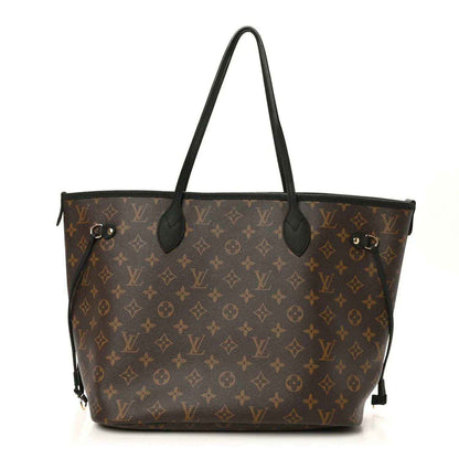 Monogram tote bag with black leather handles and gold-tone hardware