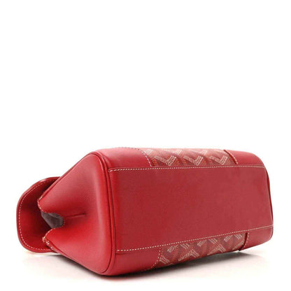 Red mini handbag angled view with top flap and coated canvas stripe trim.