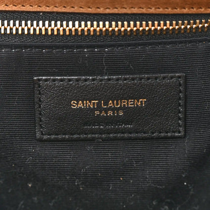 Saint Laurent interior fabric label on dark lining with gold zipper hardware.